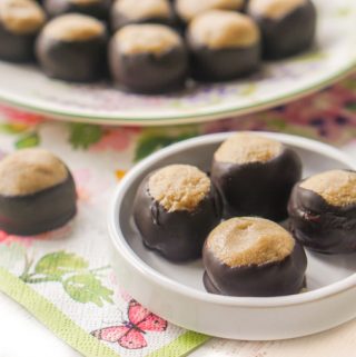 White plate with low carb buckeyes on it and floral napkin