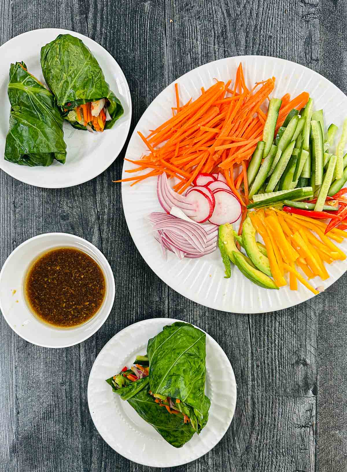Aerial view of collar green keto spring rolls with the dipping sauce and all the chopped veggies.