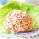 A scoop of keto ham salad using leftovers on a bed of lettuce.