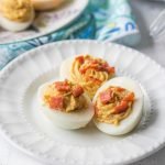 bowl of colored eggs and plates with deviled eggs and text overlay