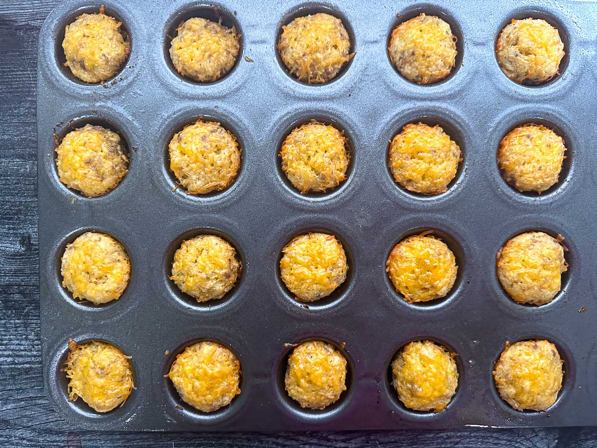 tin with the finished cheese and sausage mini muffins