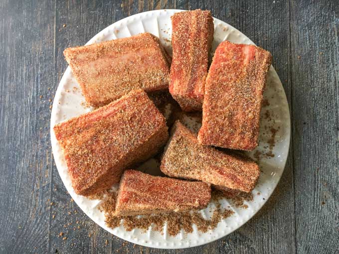 white plate with short ribs rubbed with spices