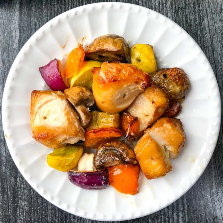 white plate with chicken and vegetable kebabs with Asian marinade