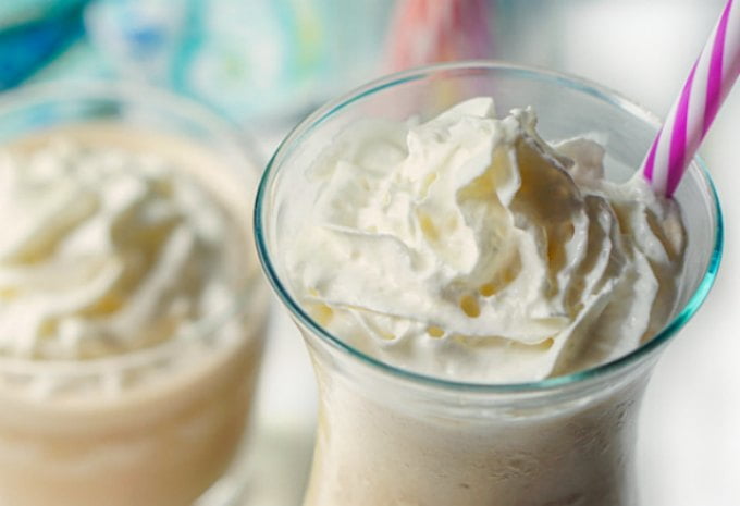 very closeup of top of drink and whipped cream