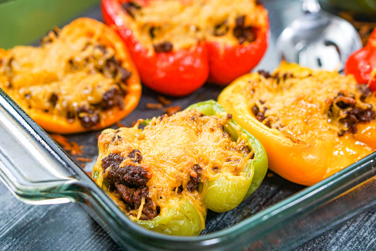closeup of a baking dish with stuffed Mexican bell peppers