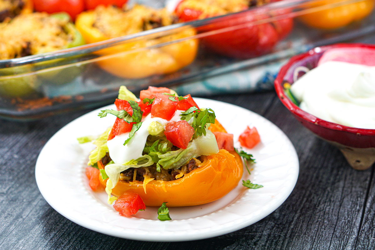 plate with a Mexican pepper with a pan of them in the background