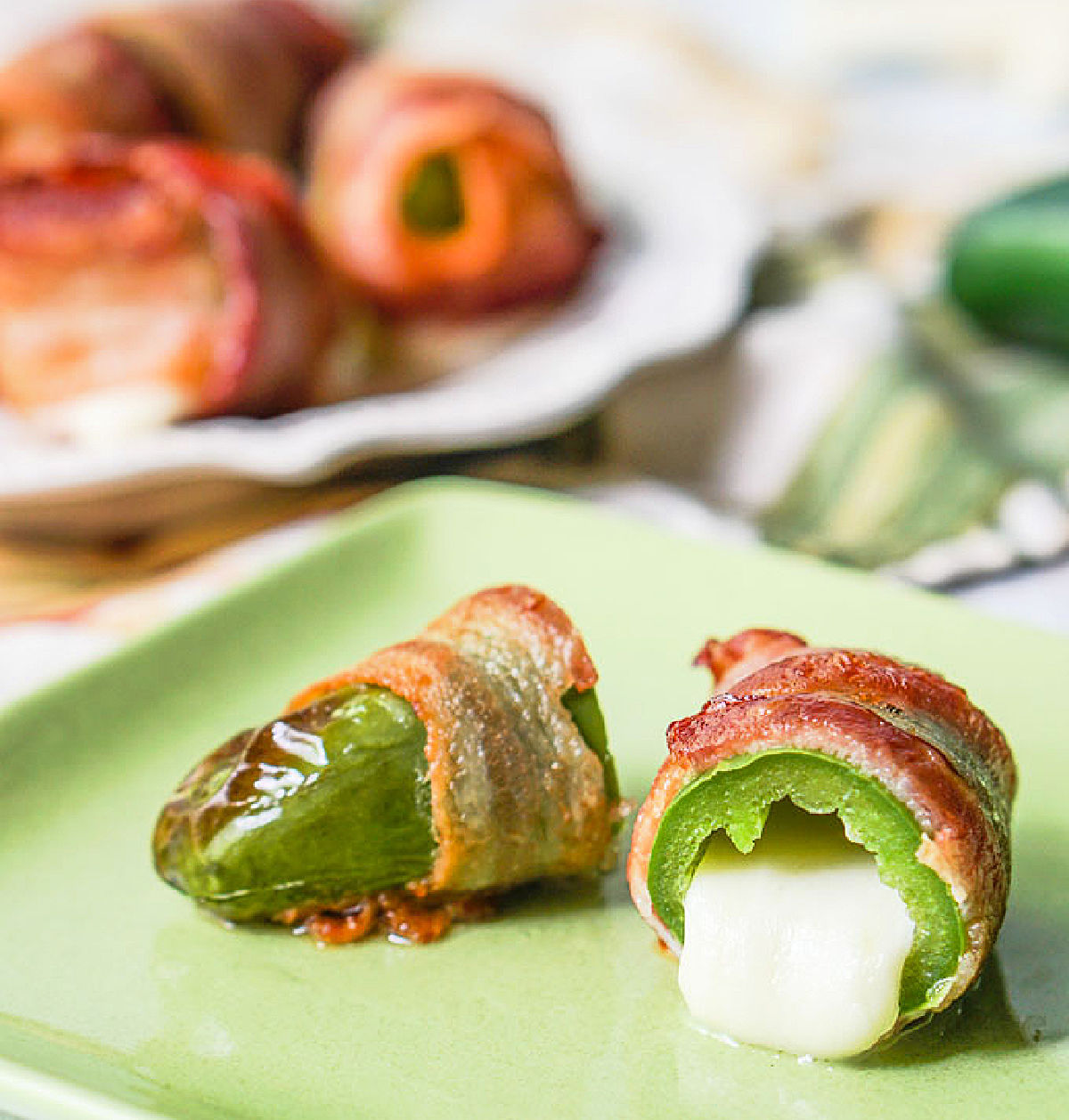 Closeup of a green plate with the finished poppers.