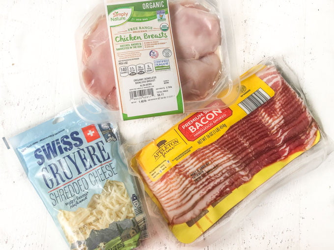 ingredients for stuffed chicken, gruyere cheese, bacon and raw chicken