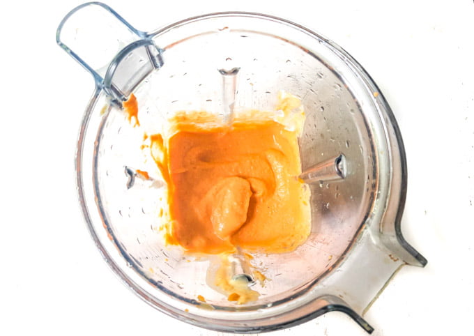 aerial view of blender with pumpkin carrot dog pop mixture inside