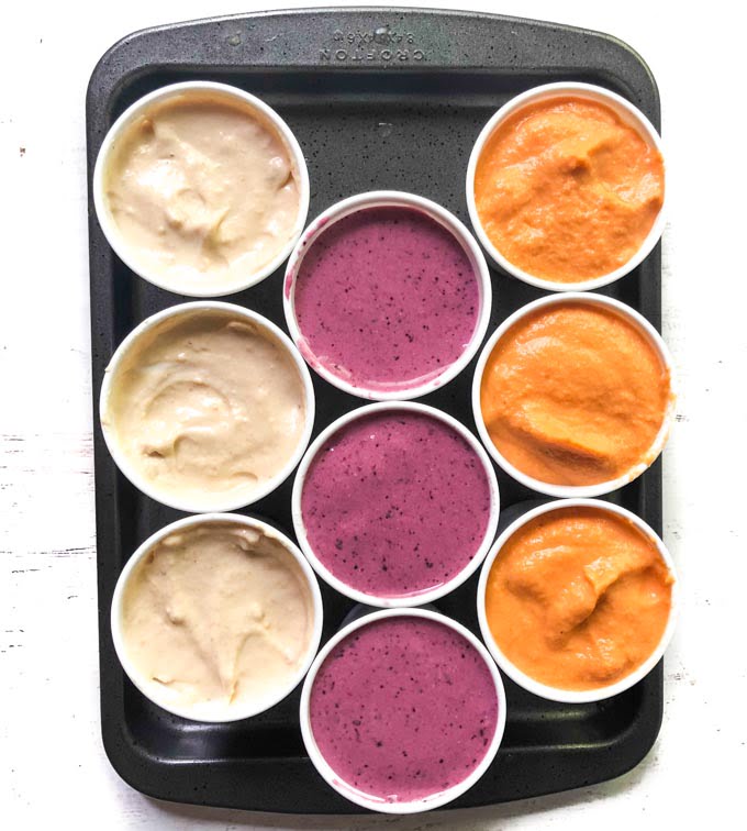cookie sheet with 3 different flavors of dog pops in Dixie cups