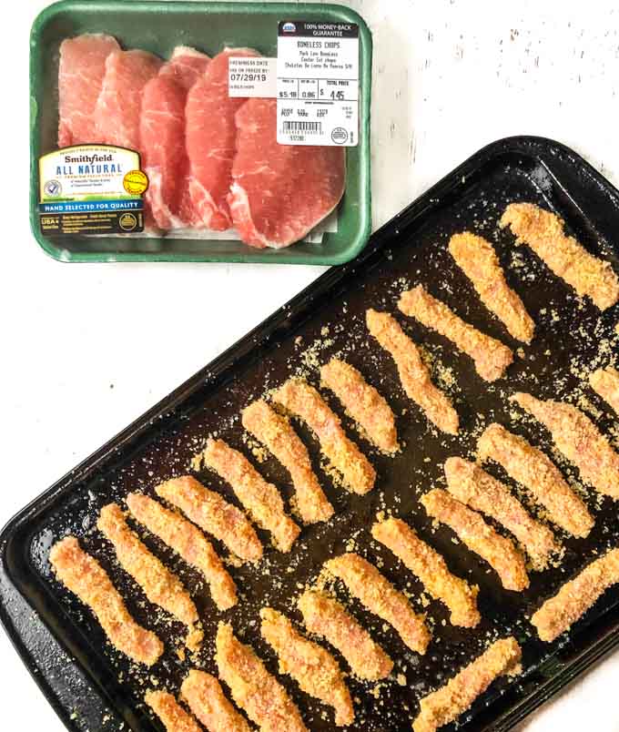 cookie sheet with breaded pork chops strips and package of Smithfield All Natural Pork Chops