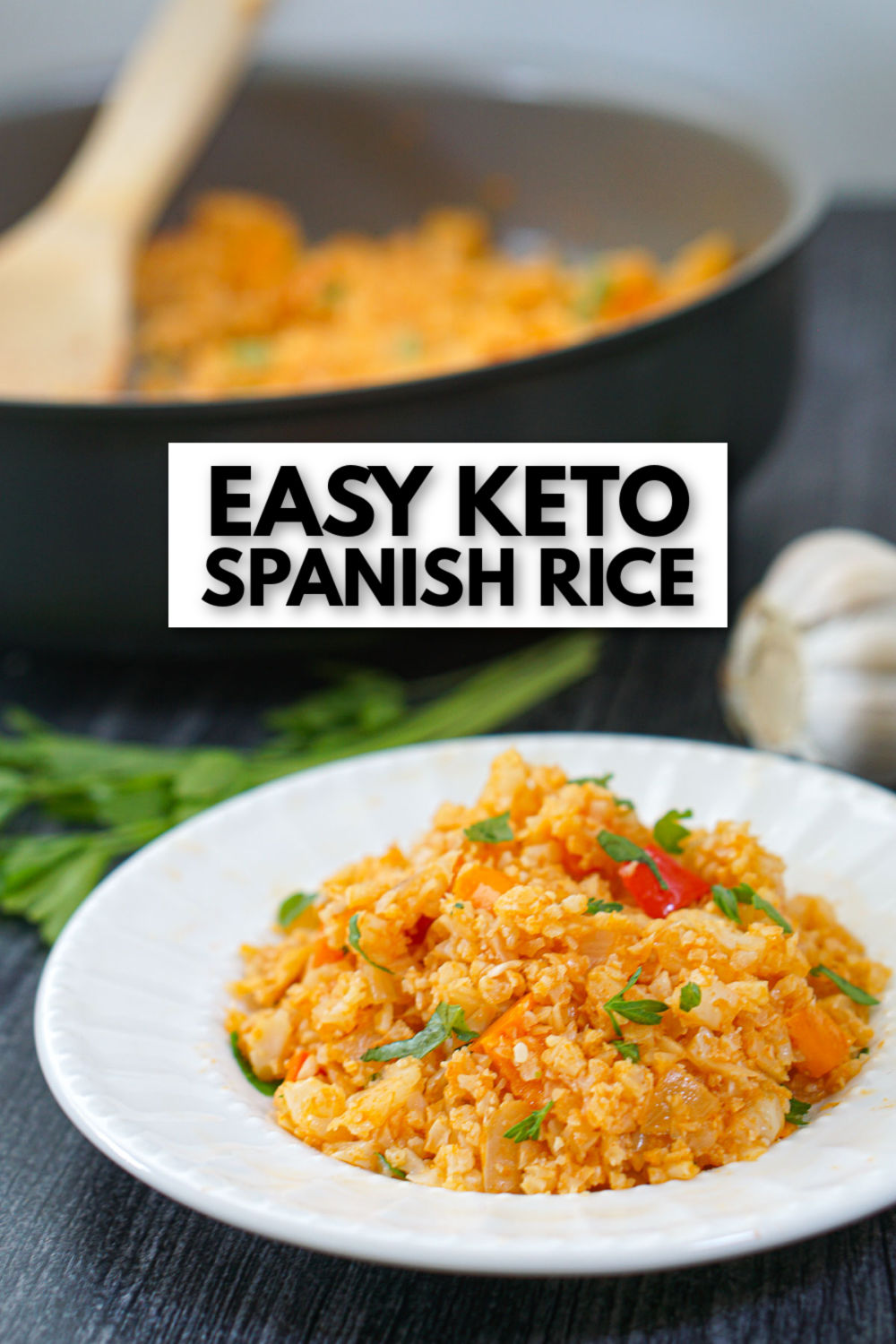 pan and white plate with Spanish cauliflower rice and text