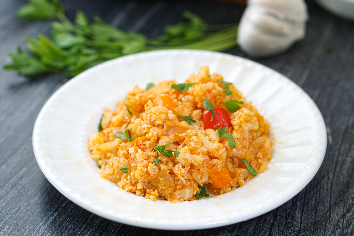 white plate with keto Spanish cauliflower rice