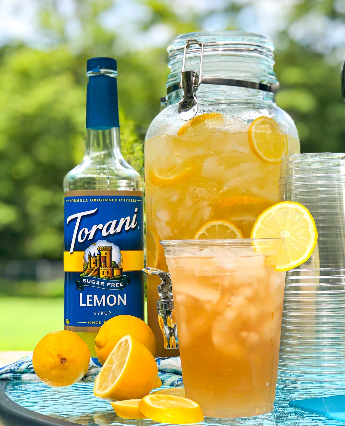 glass dispense of spiked iced tea and glass