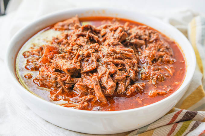 white bowl with shredded beef made in the Instant Pot