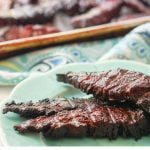 blue plate of smoked beef jerky with text overlay