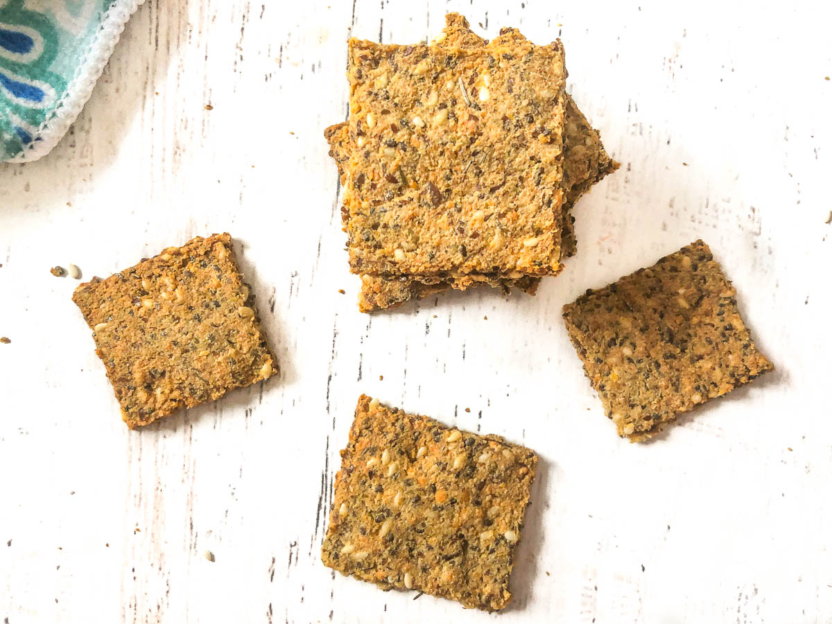 aerial view of square keto crackers scattered on table