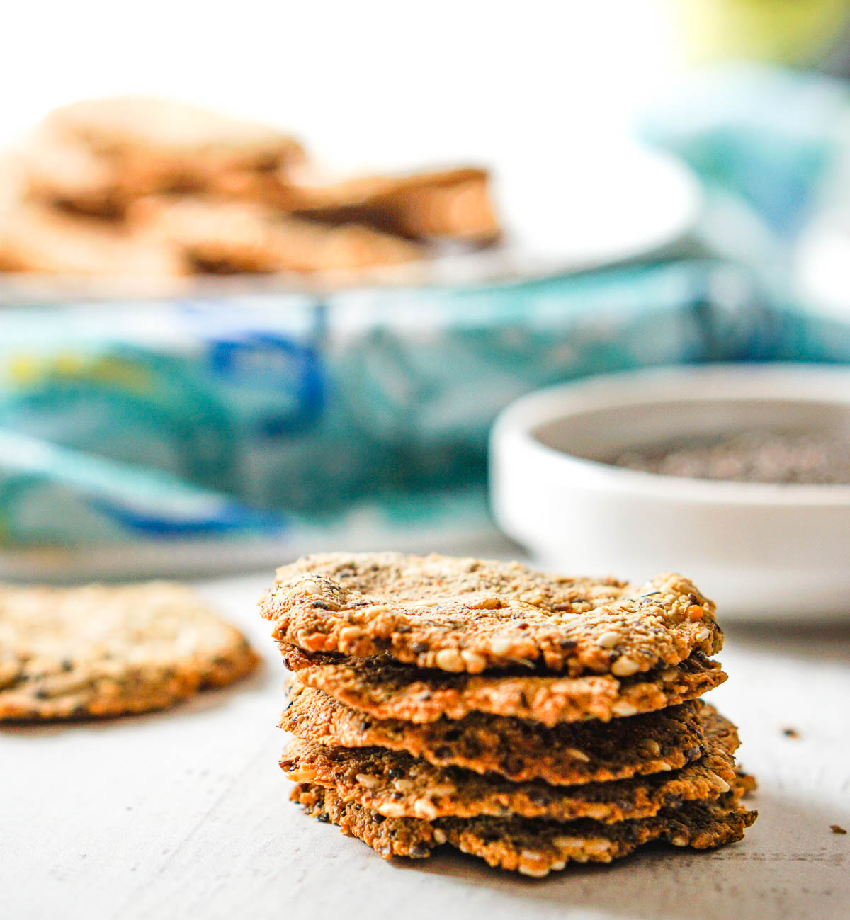 stack of keto round crackers with tray in background