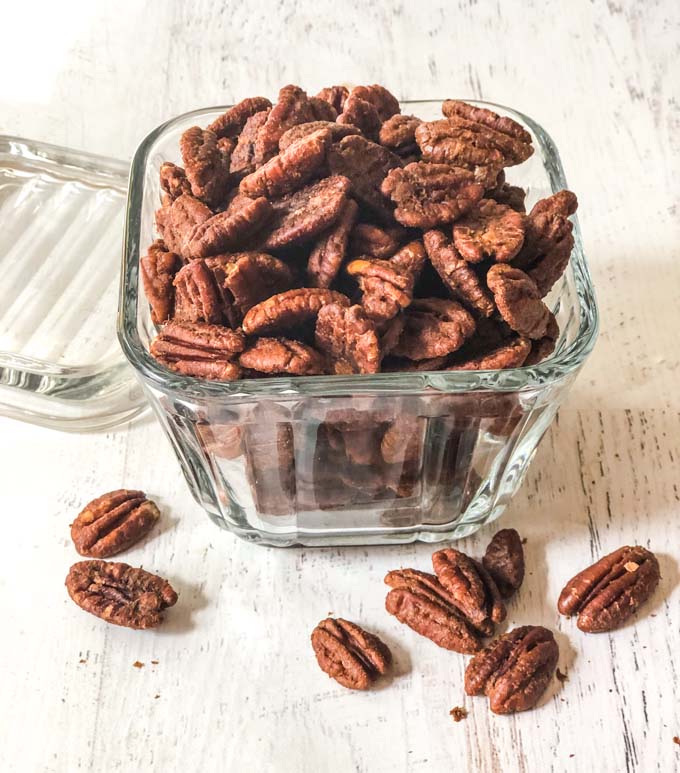 low carb honey mustard roasted pecans in a clear glass bowl