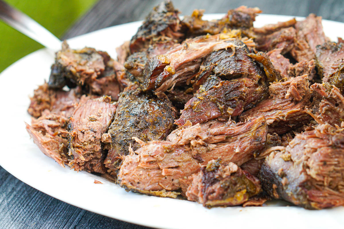 a platter with chopped up pieces of the tender gyro meat