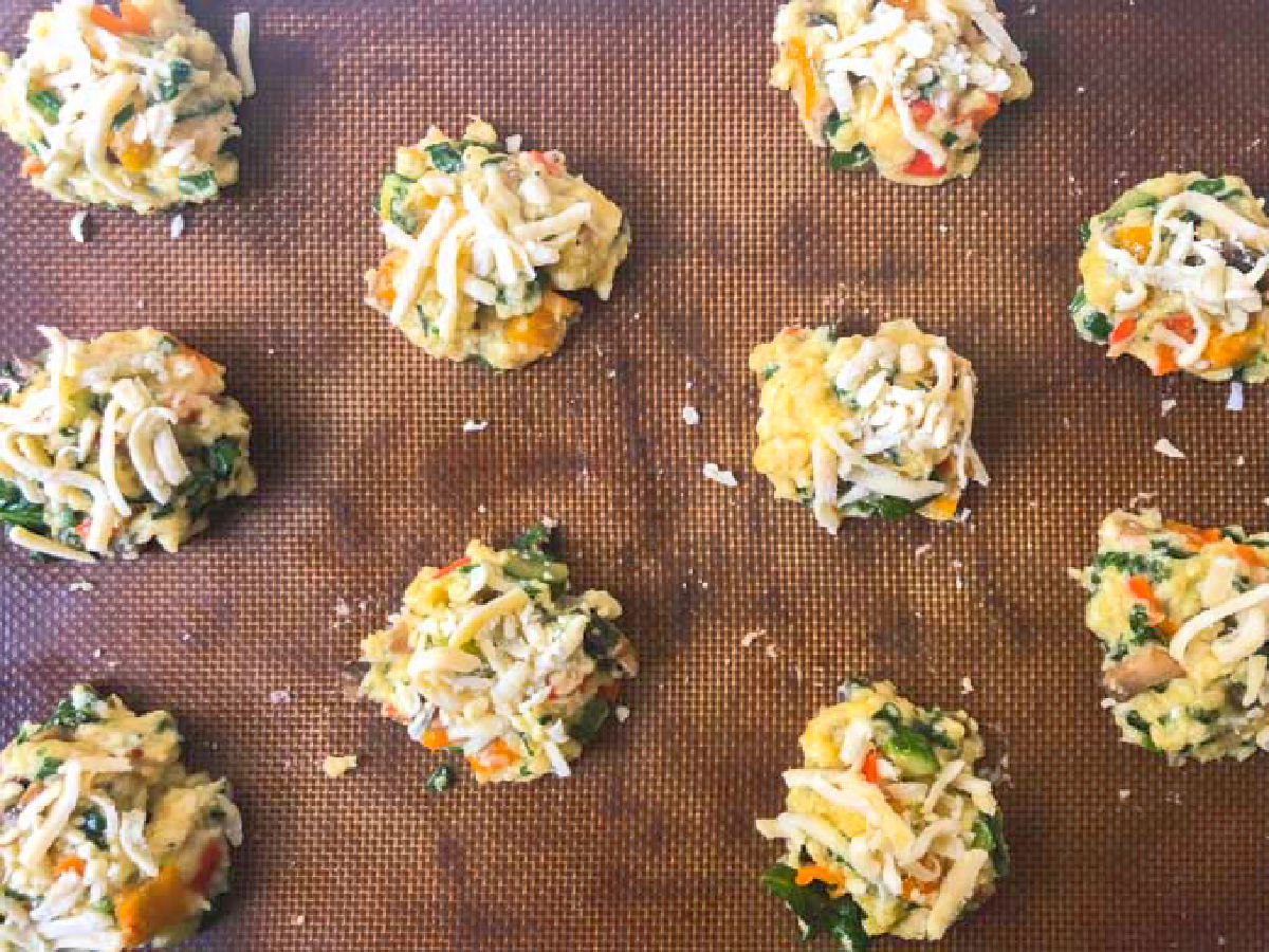 A baking sheet with the raw vegetable cookies ready to bake.