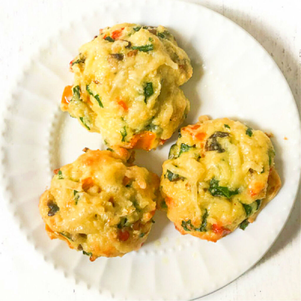 White plate with 2 low carb veggie biscuits.