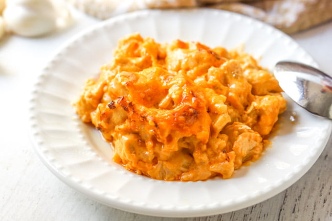 white plate with a serving of keto buffalo chicken casserole