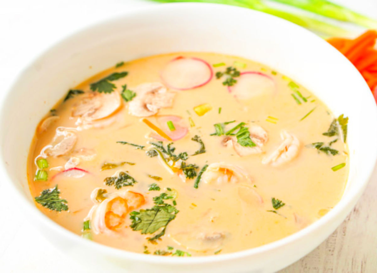 Closeup of a large bowl with the coconut curry soup with fresh cilantro on top.