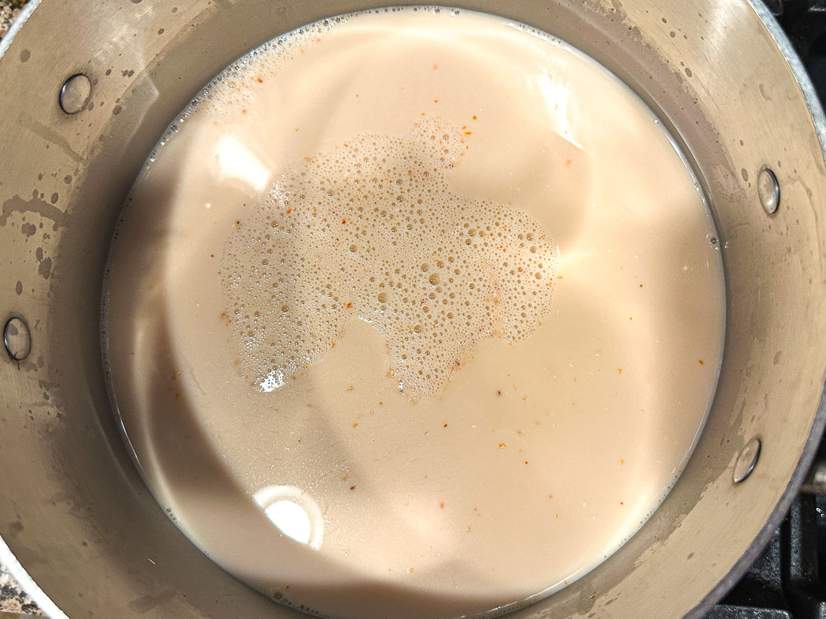 Soup pot with the liquid ingredients and spices.