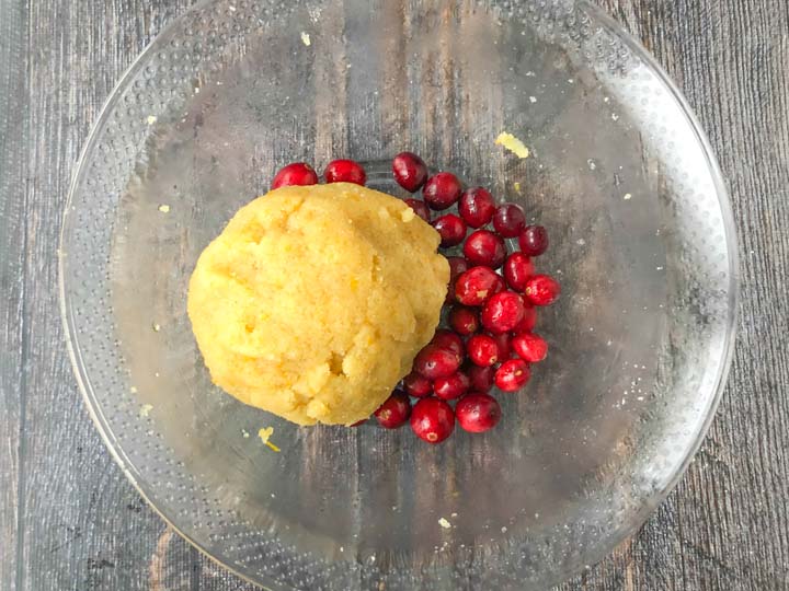 low carb scone dough with fresh cranberries in a clear glass bowl
