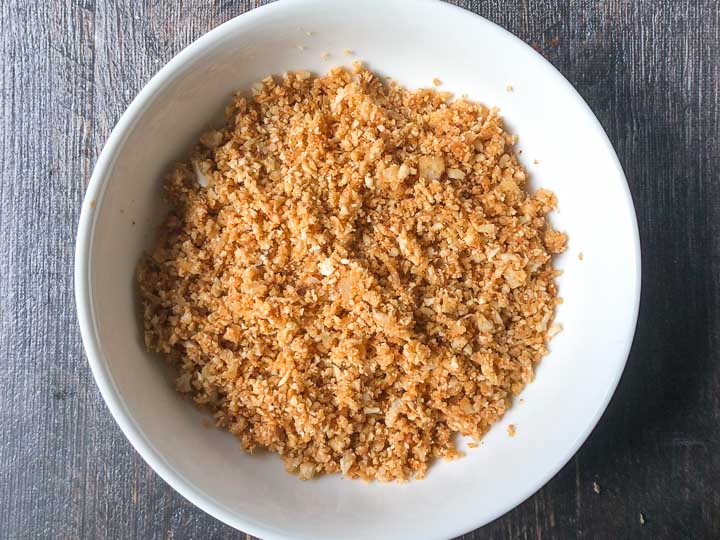 white bowl with cooked  Mexican flavored cauliflower rice