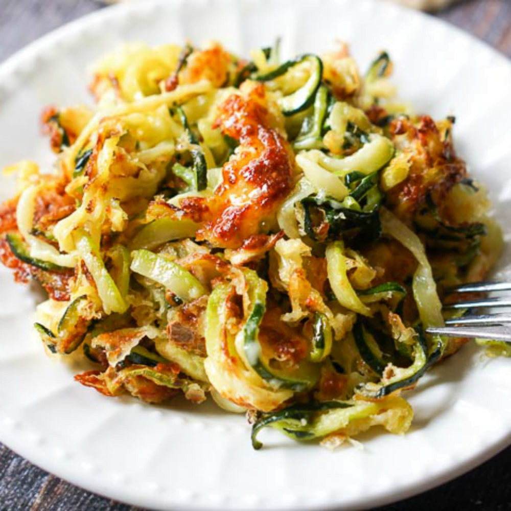 closeup of air fryer cheesy zucchini noodles