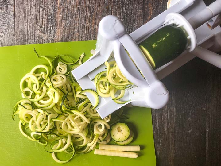 Paderno vegetable peeler making zucchini noodles on green cutting mat