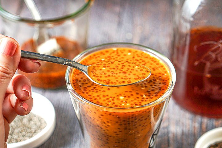 a glass of the Thai tea with a spoonful of the chia seeds