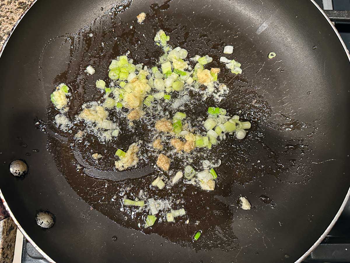 Skillet with garlic, ginger and onions.