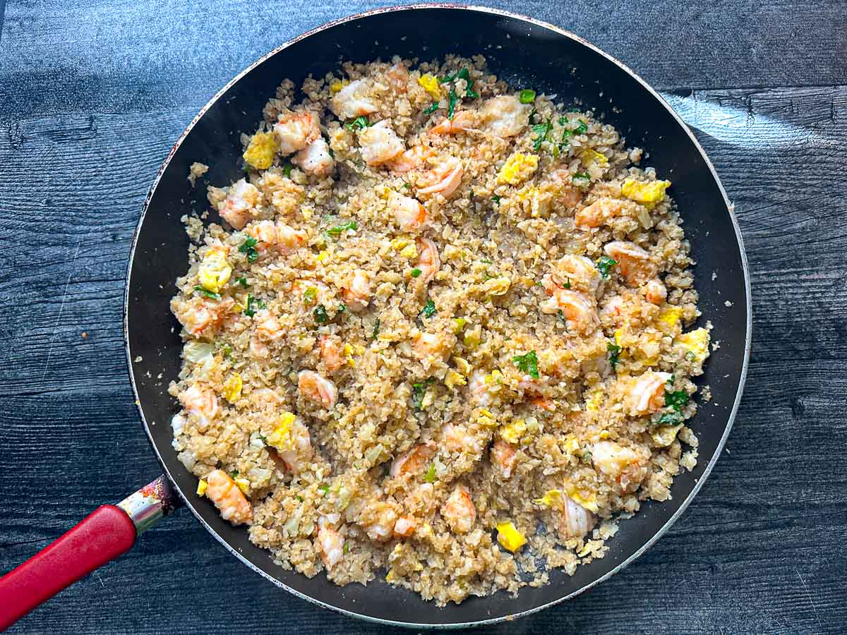 A skillet with the finished low carb fried rice.