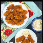 Aerial view of white plates of keto fish sticks made in the air fryer and a bowl of tartar sauce and text.