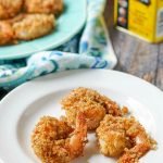 white plate with keto old bay fried shrimp made in the air fryer and text