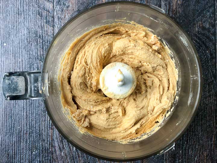 bowl of a food processor with keto protein fudge batter