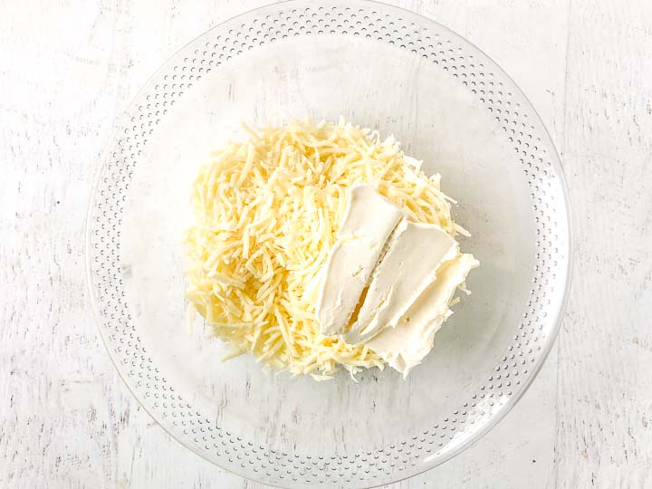 glass bowl with cream cheese and mozzarella