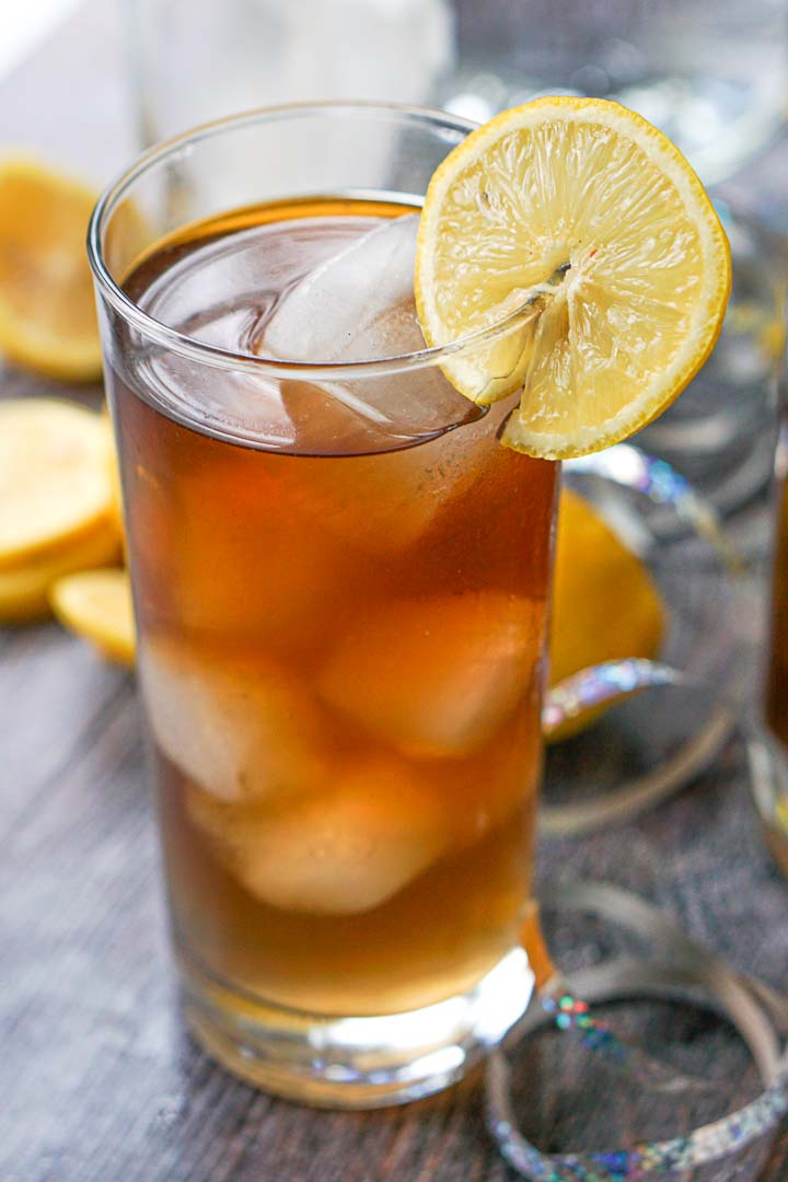 a tall iced glass with a slice of lemon and keto Long Island iced tea drink 