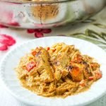 low carb cajun chicken spaghetti squash skillet with text and white plate