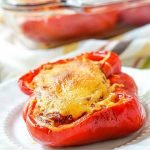 baking dish with keto bbq pulled chicken stuffed peppers and text overlay
