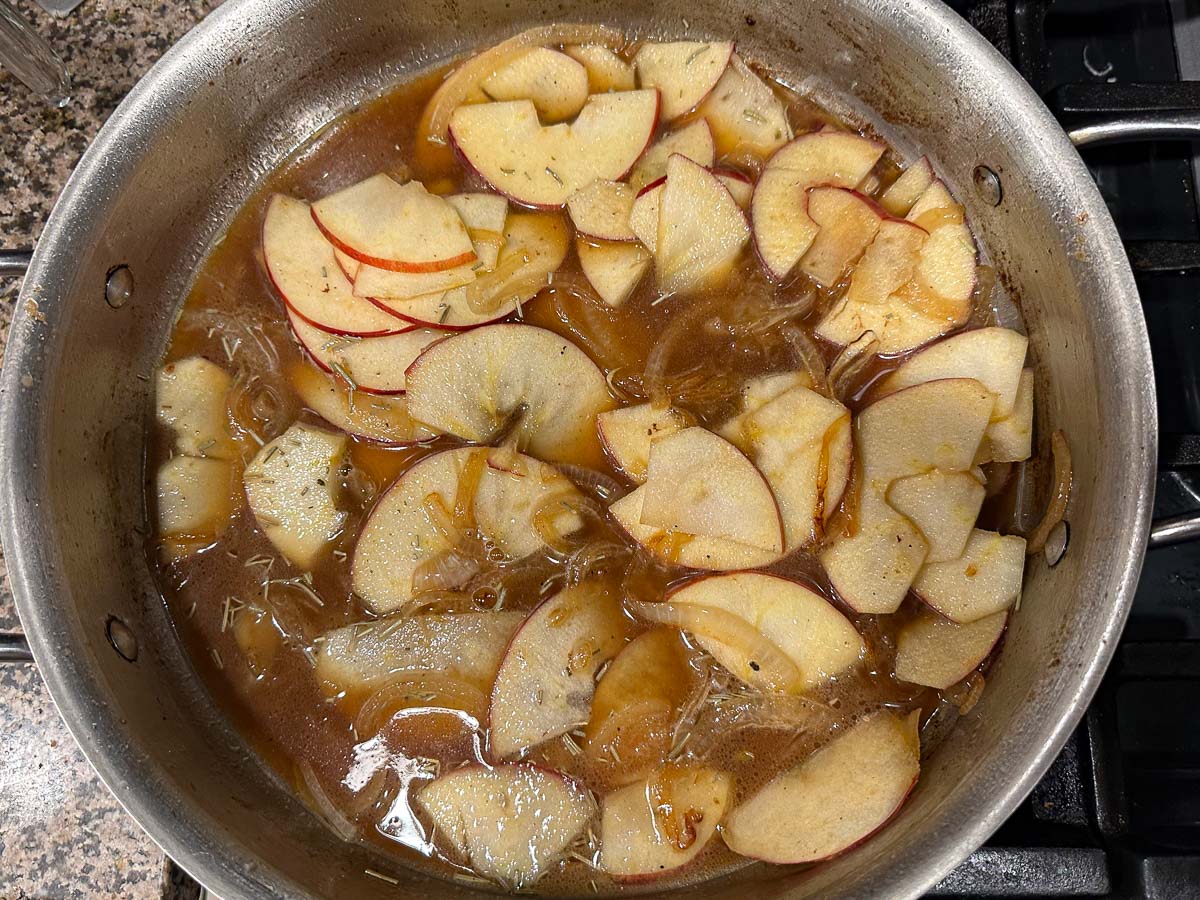 pan with sautéed apple slices and onions