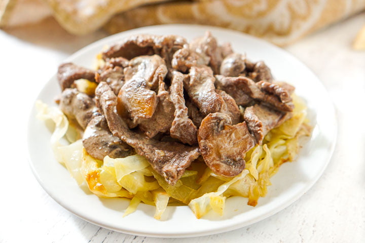 white plate with cabbage noodles and keto beef stroganoff