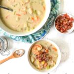 white bowls with keto seafood chowder and a small bowl of bacon crumbles and text