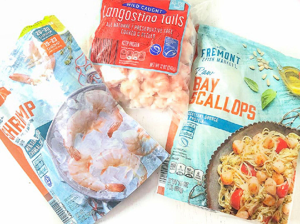 3 bags of seafood from Aldi - scallops, langoustinos and shrimp.