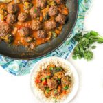 white plate and saute pan with Thai curry keto meatballs and text overlay