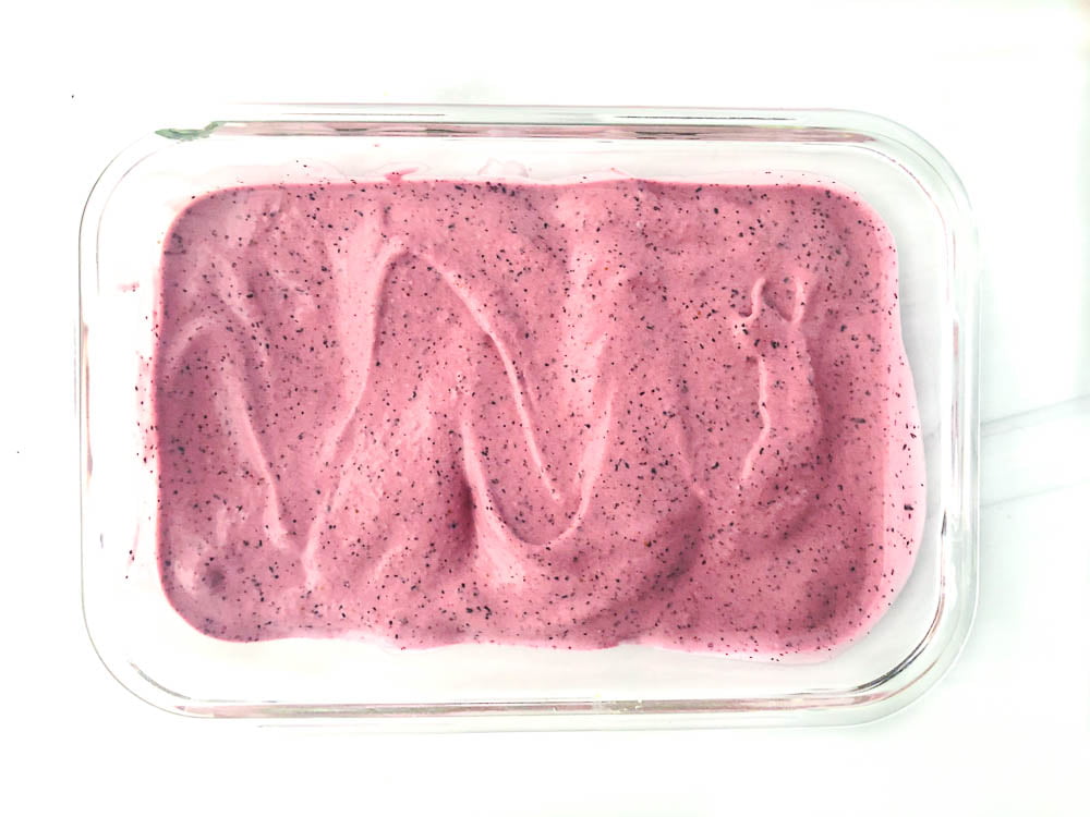 shallow glass container with the blueberry mixture ready to freeze