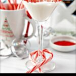 glass with keto candy cane martini and scattered candy canes and text